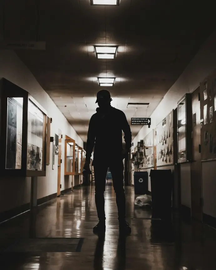 man standing on rooms pathway